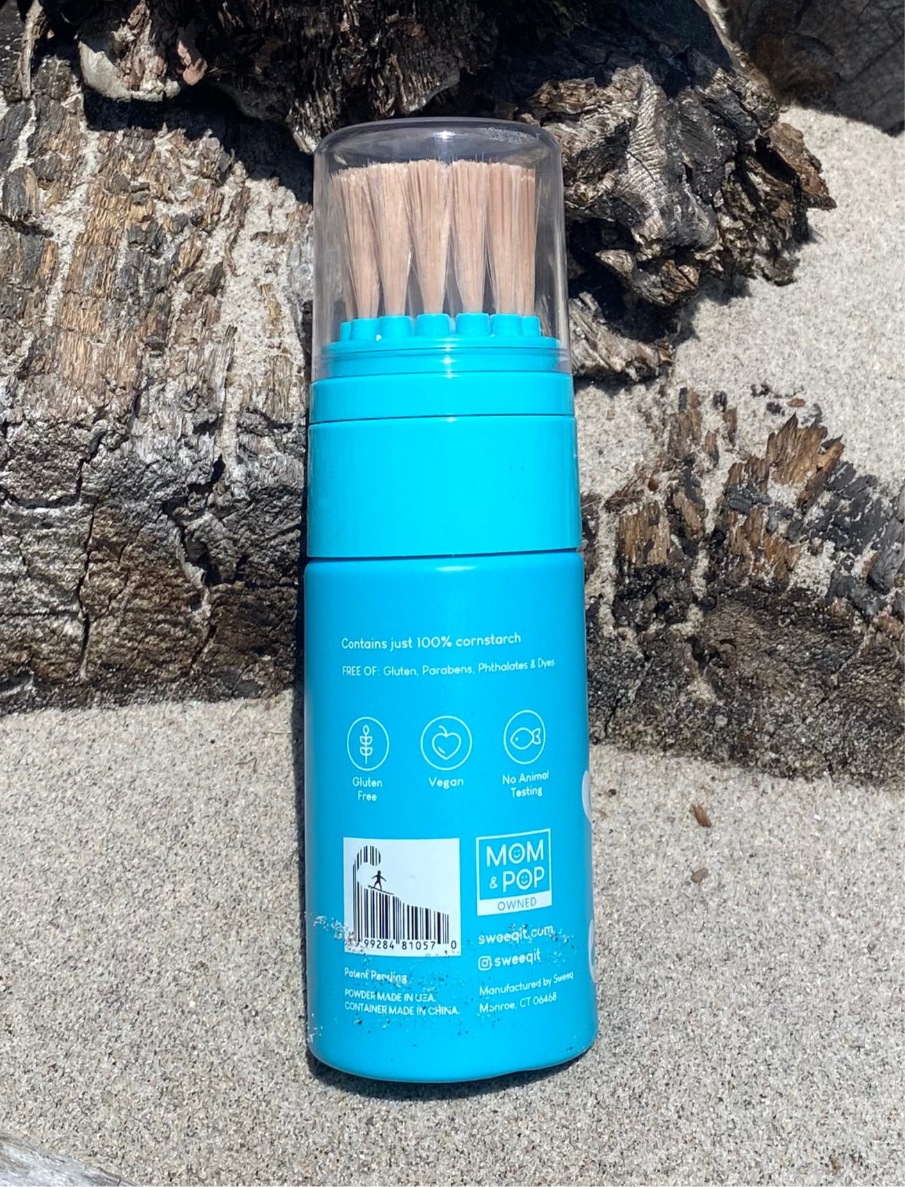 Back of Sweeq natural non-toxic sand remover bottle safe for kids and beach use